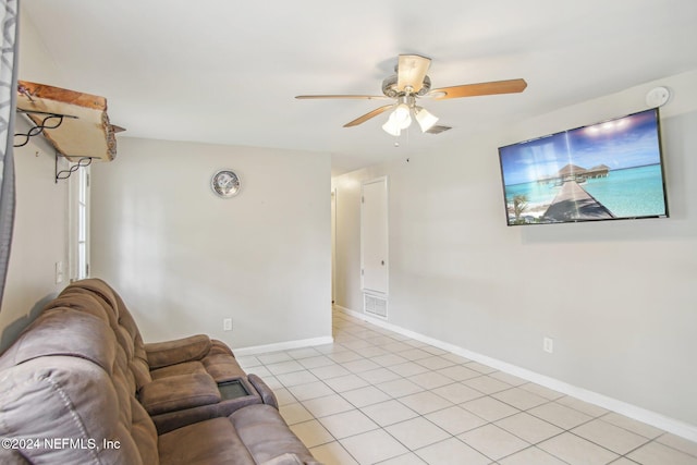 living room with ceiling fan and light tile patterned floors