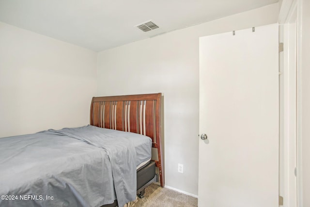 bedroom with light carpet