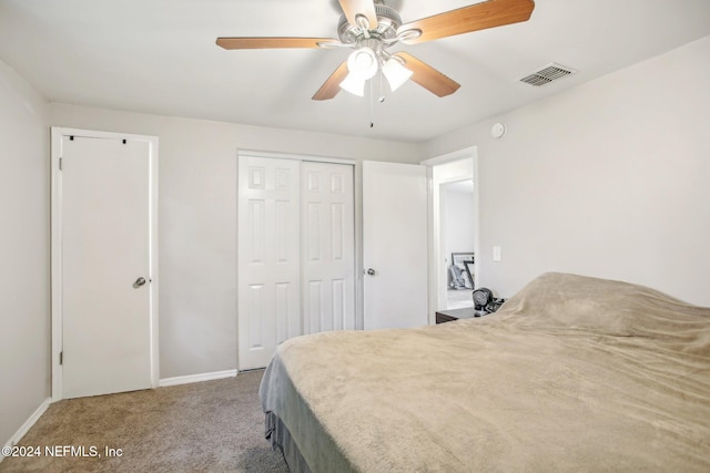 bedroom with carpet flooring, ceiling fan, and a closet