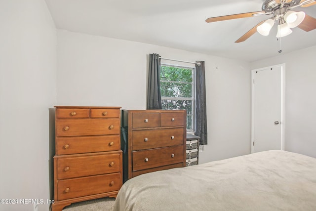 bedroom with ceiling fan and carpet floors