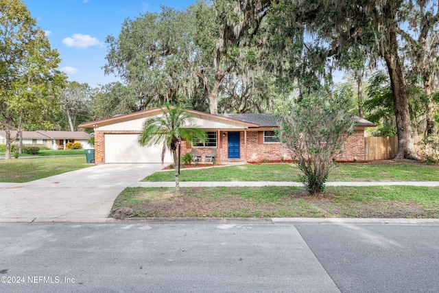 view of front facade with a garage and a front yard