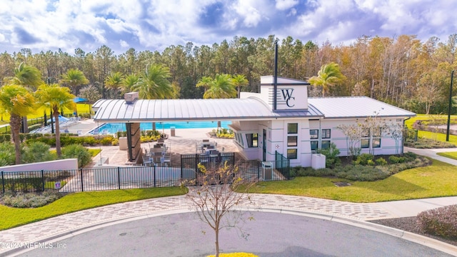 view of building exterior with a community pool