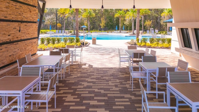 view of patio / terrace featuring a community pool