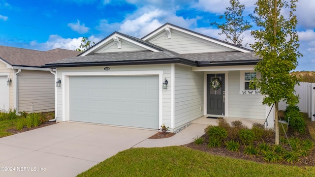 ranch-style home featuring a garage