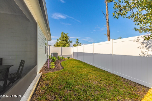 view of yard featuring central AC