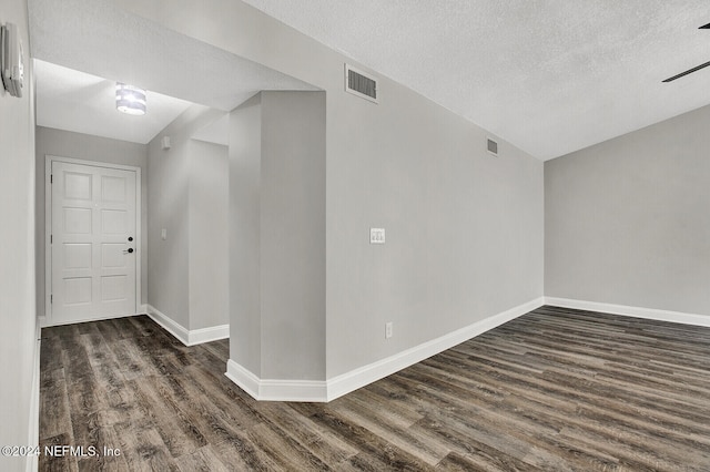 interior space featuring a textured ceiling, dark hardwood / wood-style floors, and ceiling fan