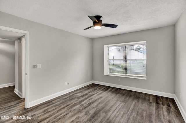 unfurnished room featuring dark hardwood / wood-style flooring, a textured ceiling, and ceiling fan