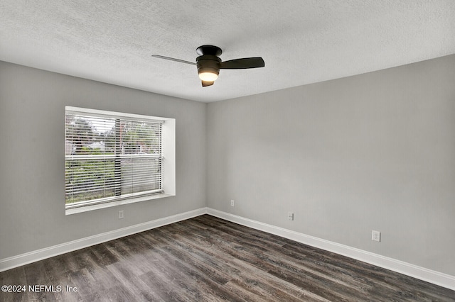 spare room featuring ceiling fan, a textured ceiling, and dark hardwood / wood-style flooring