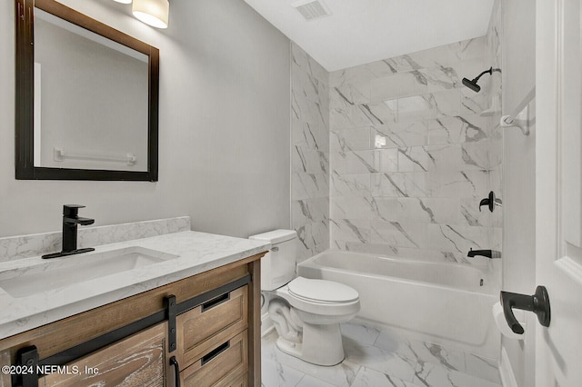 full bathroom featuring vanity, tiled shower / bath combo, and toilet