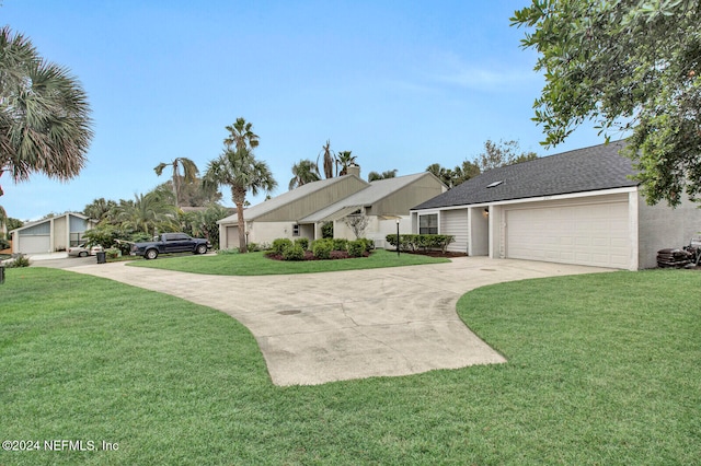 single story home featuring a garage and a front yard