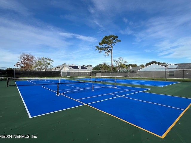 view of sport court with basketball hoop