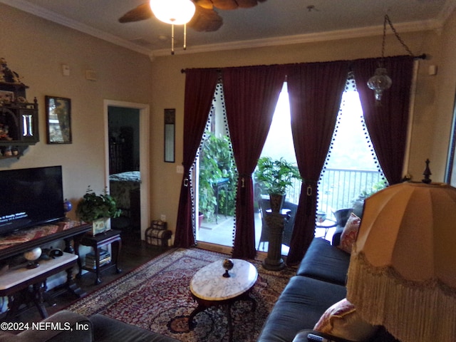 living room featuring ceiling fan and crown molding