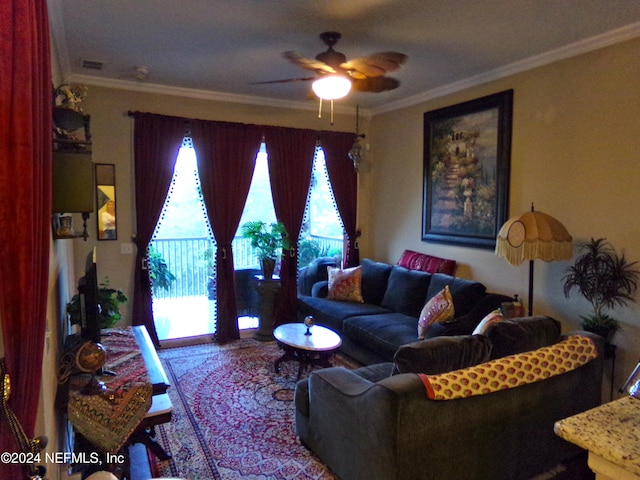 living room featuring ornamental molding and ceiling fan