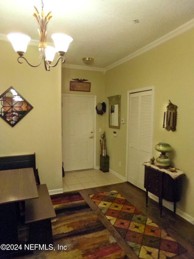 interior space featuring a notable chandelier, crown molding, and wood-type flooring