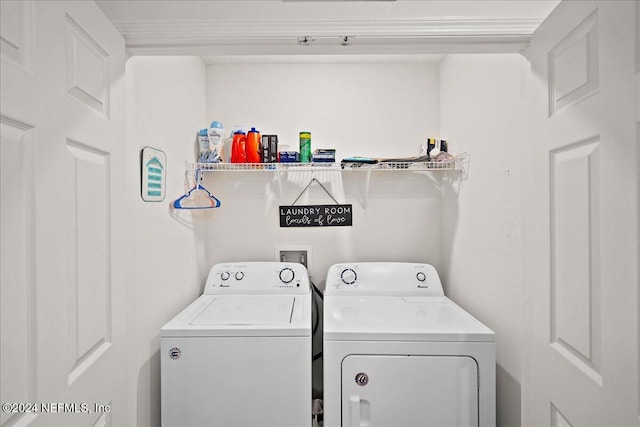 clothes washing area featuring washing machine and clothes dryer