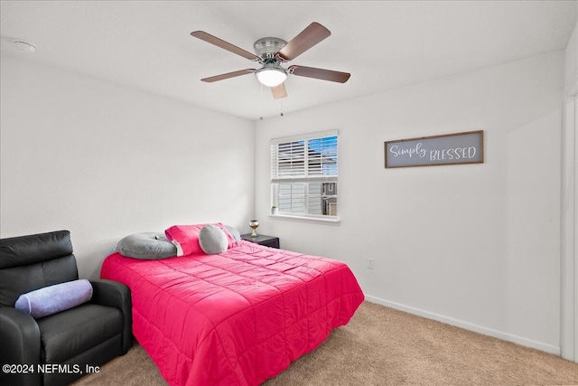 bedroom featuring light colored carpet and ceiling fan