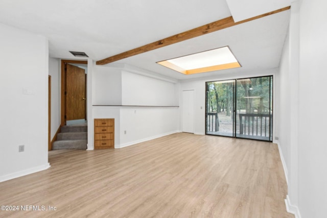 spare room featuring light hardwood / wood-style flooring