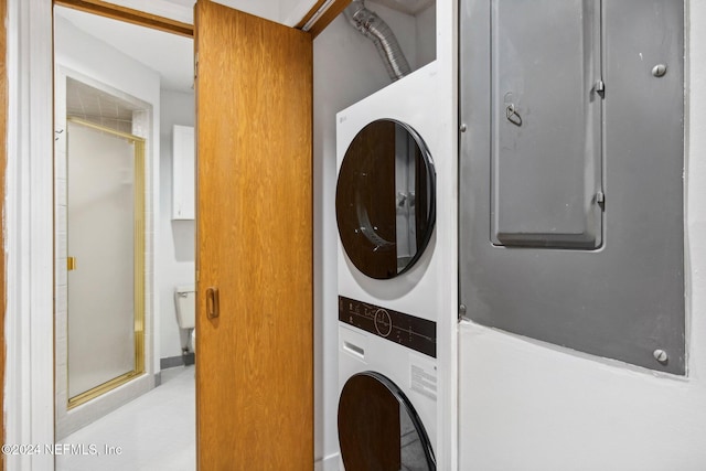 laundry area with stacked washer and clothes dryer