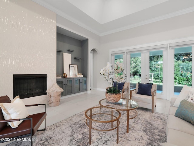 living room featuring ornamental molding, light tile patterned flooring, and plenty of natural light