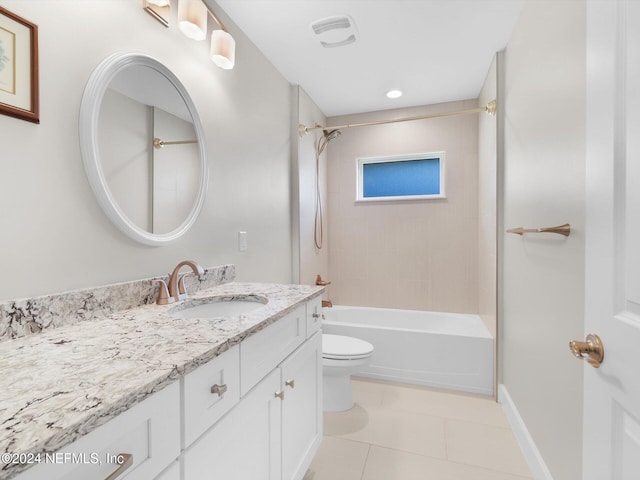 full bathroom with vanity, tile patterned floors, toilet, and tiled shower / bath combo