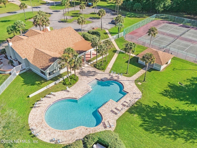 view of pool featuring a yard and a patio area