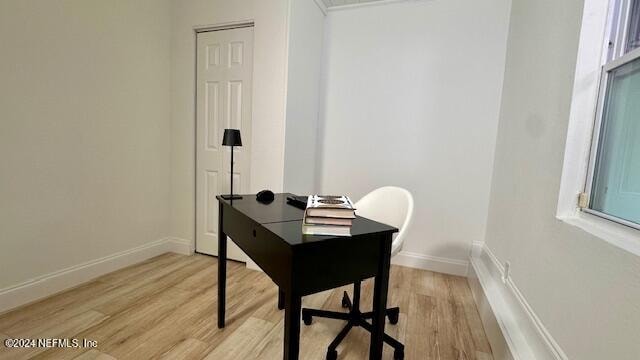 office space with light wood-type flooring