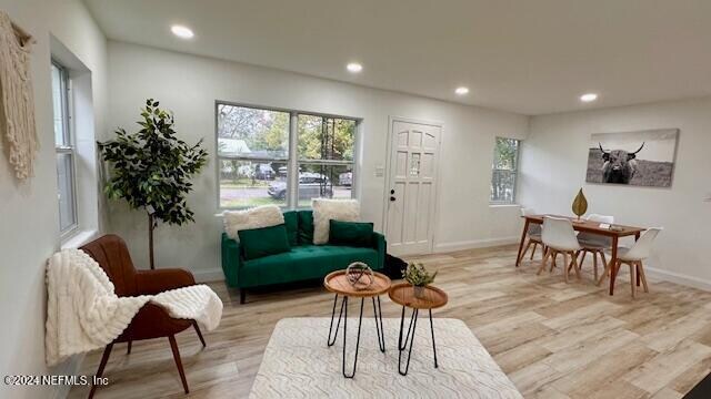 sitting room featuring light hardwood / wood-style flooring