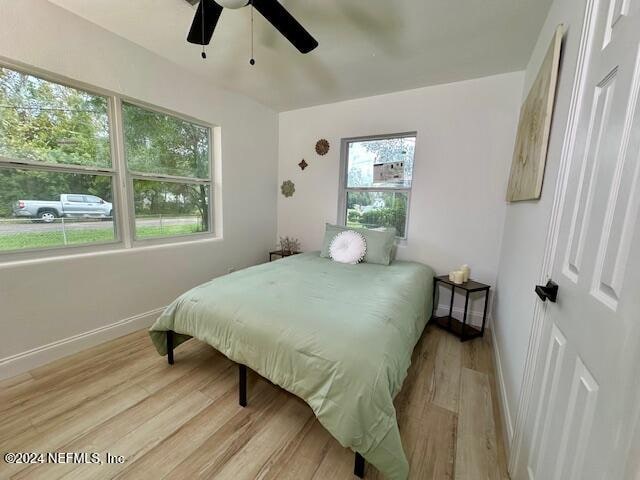 bedroom featuring light wood-type flooring and ceiling fan