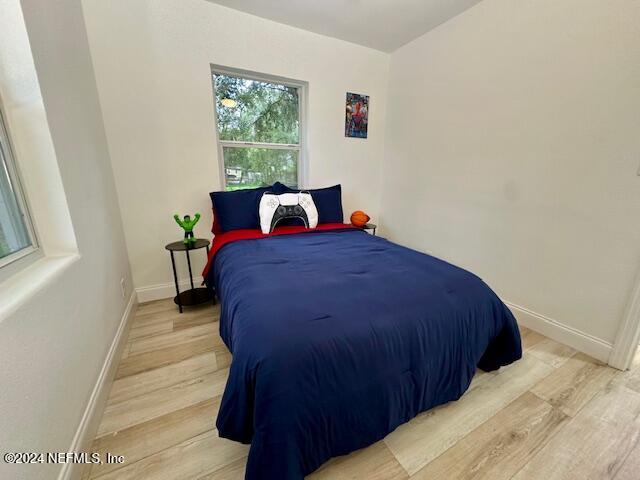 bedroom with light hardwood / wood-style floors