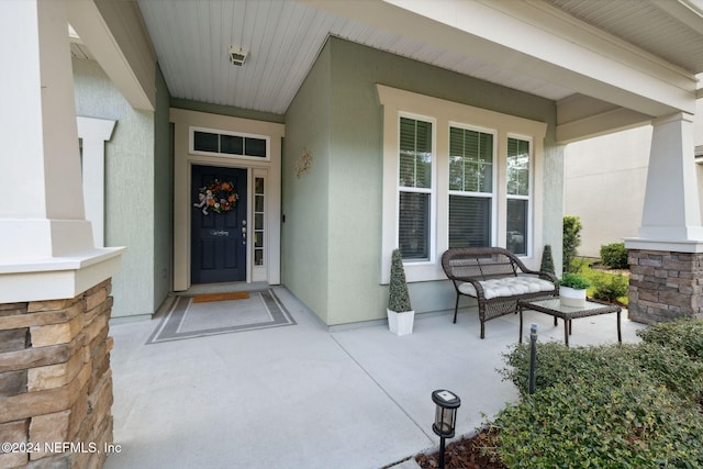 property entrance with covered porch