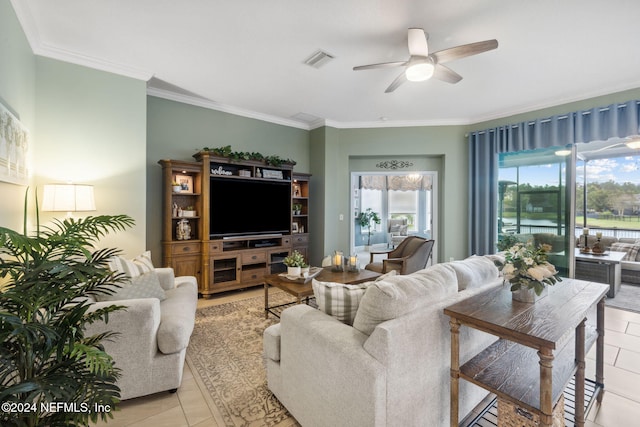 tiled living room featuring ceiling fan and ornamental molding