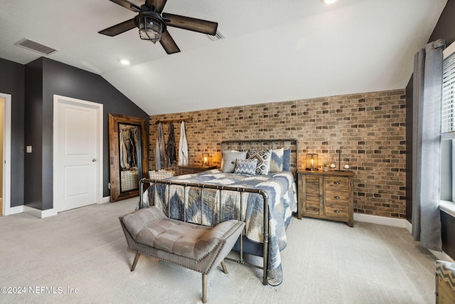 carpeted bedroom featuring brick wall, ceiling fan, and lofted ceiling