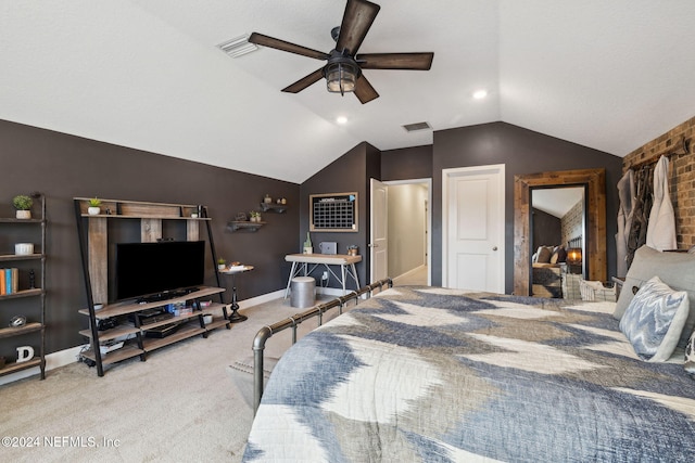 carpeted bedroom with ceiling fan and vaulted ceiling