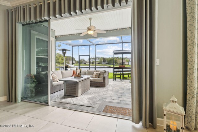 sunroom featuring ceiling fan