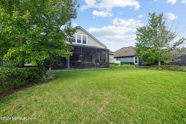 view of yard featuring a sunroom