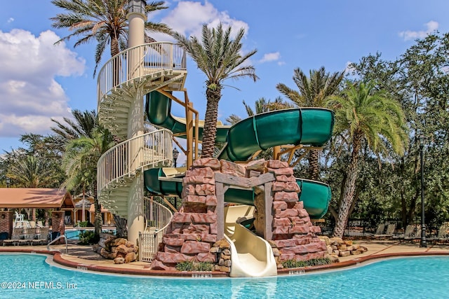 view of pool featuring a water slide