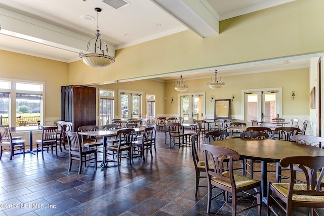 dining space featuring a wealth of natural light, french doors, and ornamental molding