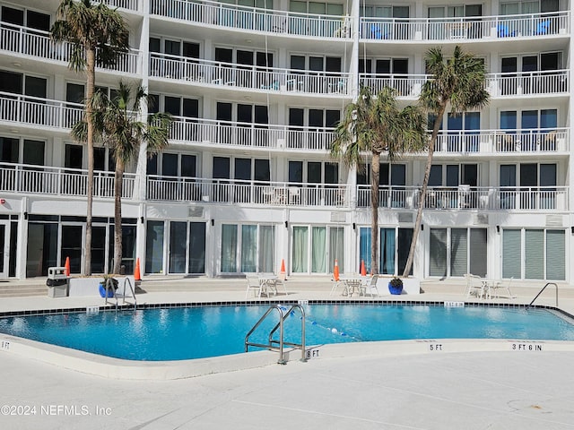 view of swimming pool featuring a patio