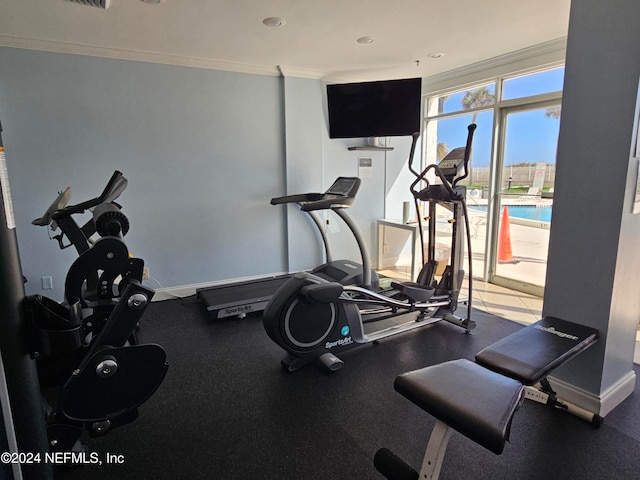 workout area with crown molding