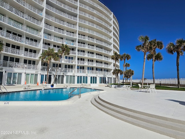 view of swimming pool with a patio