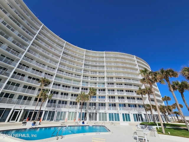 view of property featuring a community pool