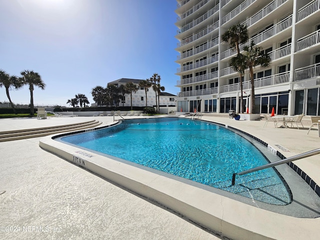 view of pool featuring a patio