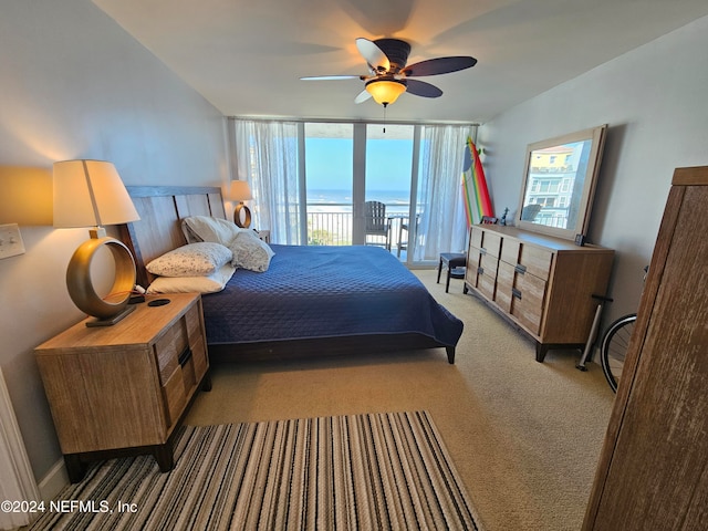 bedroom with access to outside, light carpet, ceiling fan, and floor to ceiling windows