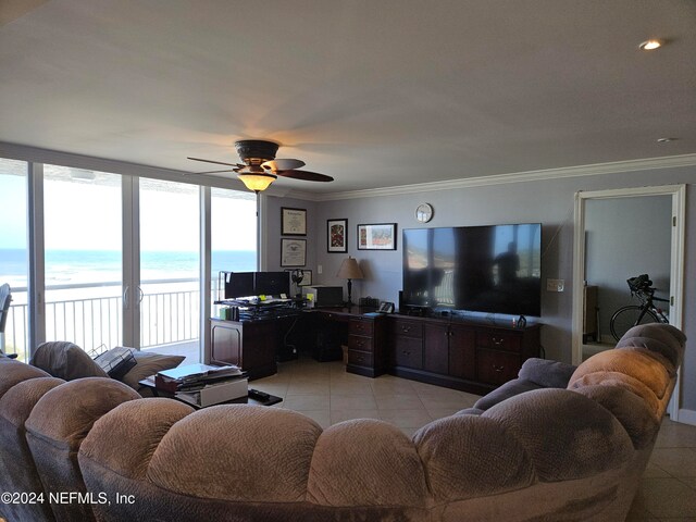 living room featuring light tile patterned floors, ceiling fan, and crown molding