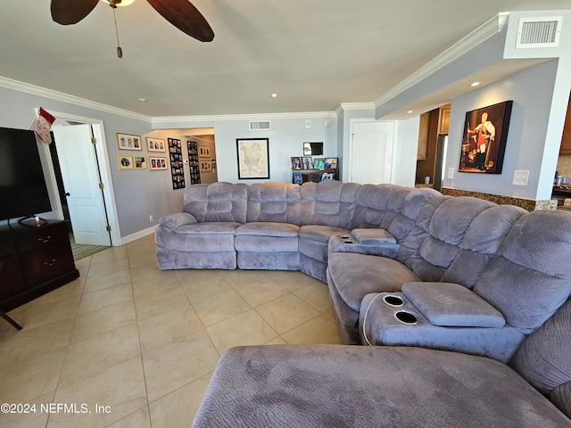 tiled living room with ceiling fan and ornamental molding