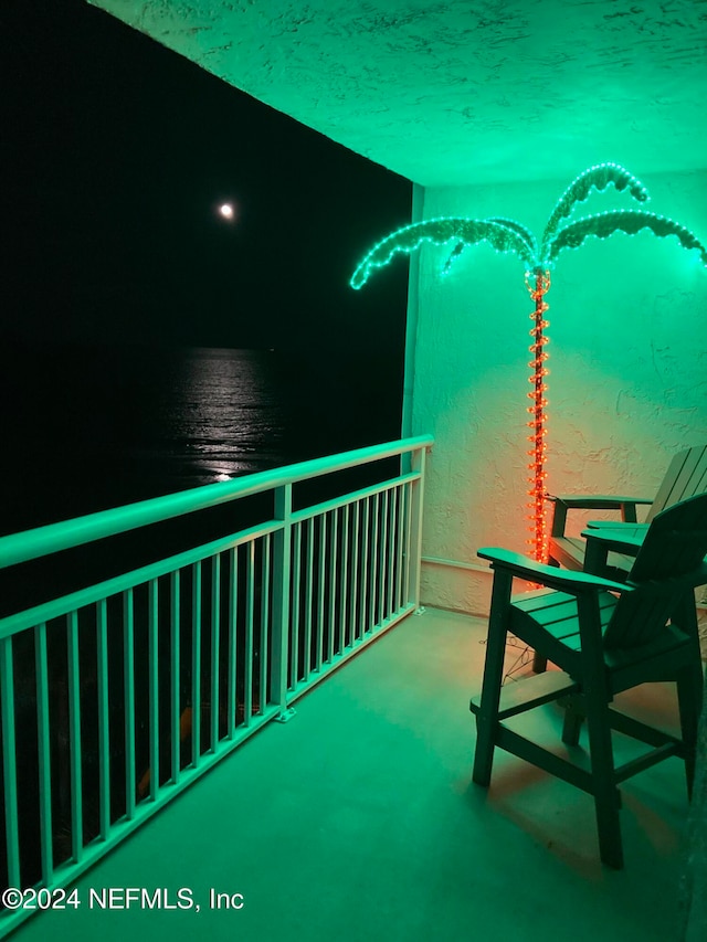 balcony featuring a water view