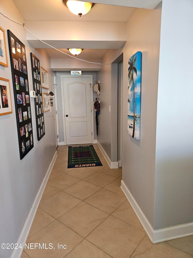 doorway featuring tile patterned flooring