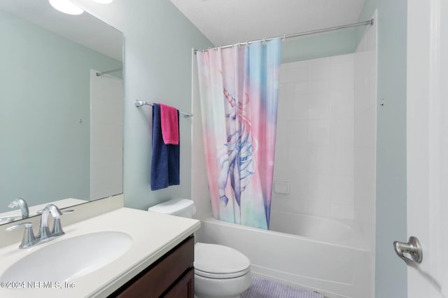 full bathroom featuring toilet, vanity, and shower / bath combo with shower curtain