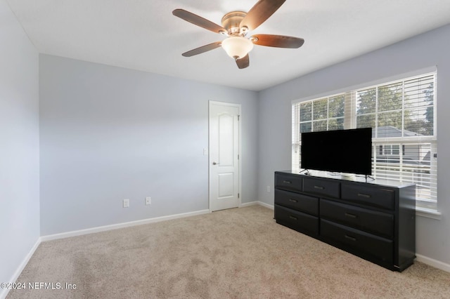 carpeted bedroom with ceiling fan