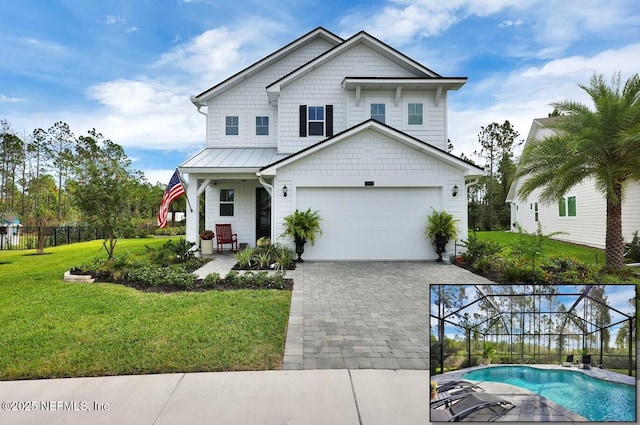 view of front of property featuring a lanai and a front lawn